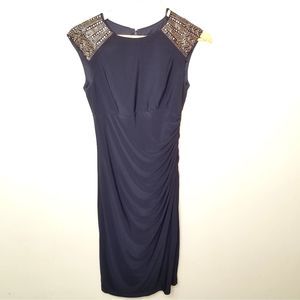 EUC Xscape navy body con w/ gold detailing size 6